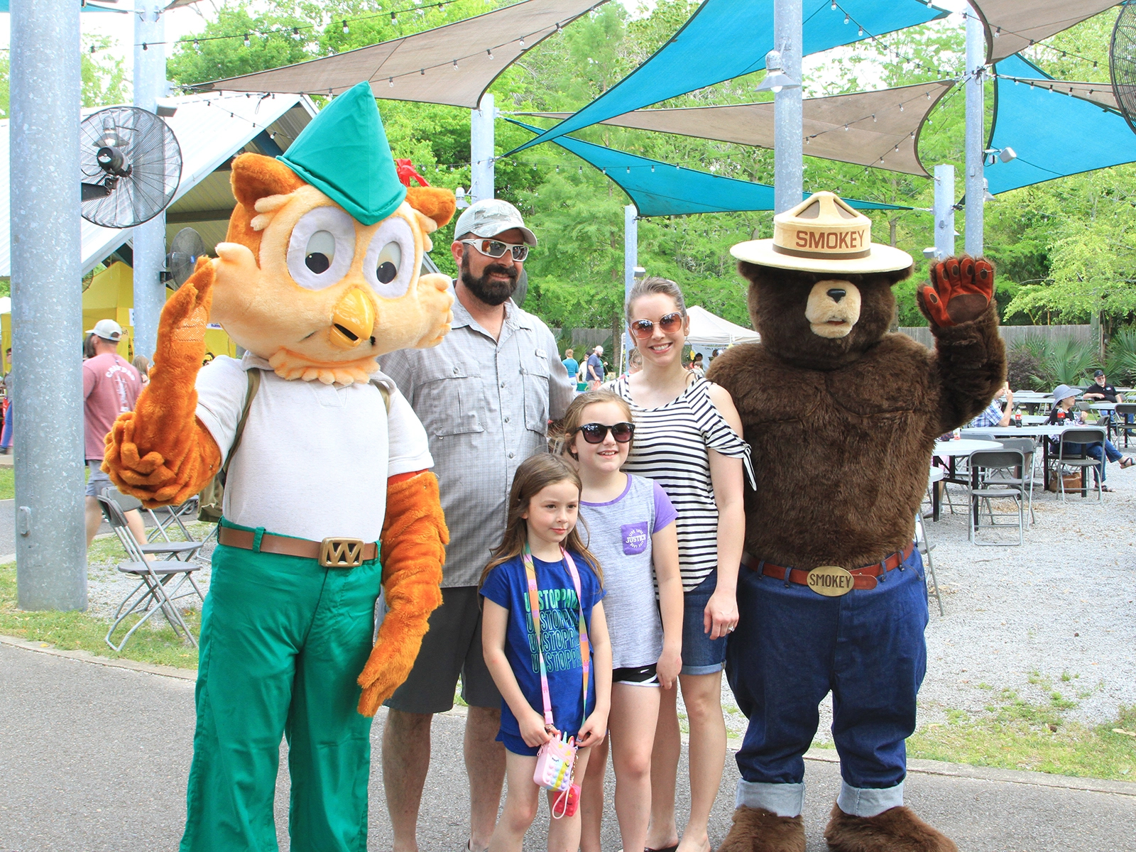 guests taking picture with costume character