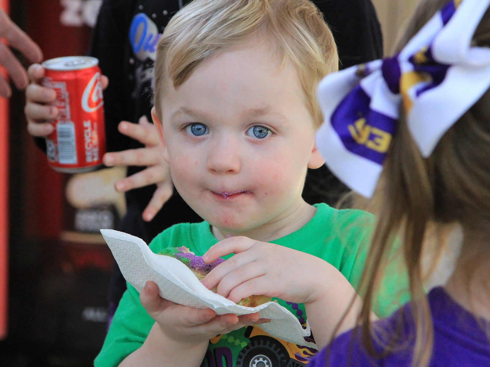 child enjoying king cake