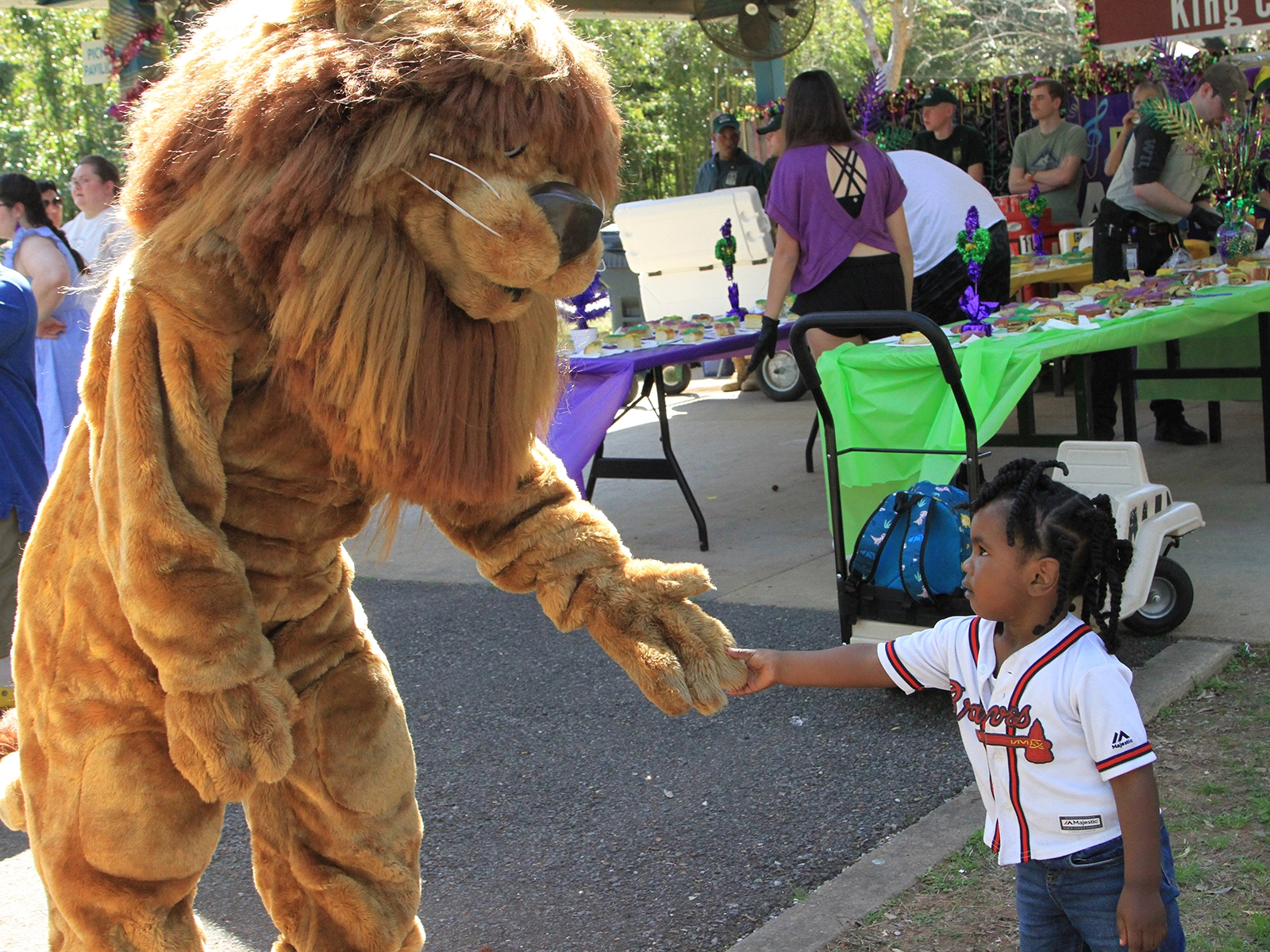 child with Zoo costumed character Roary the Lion