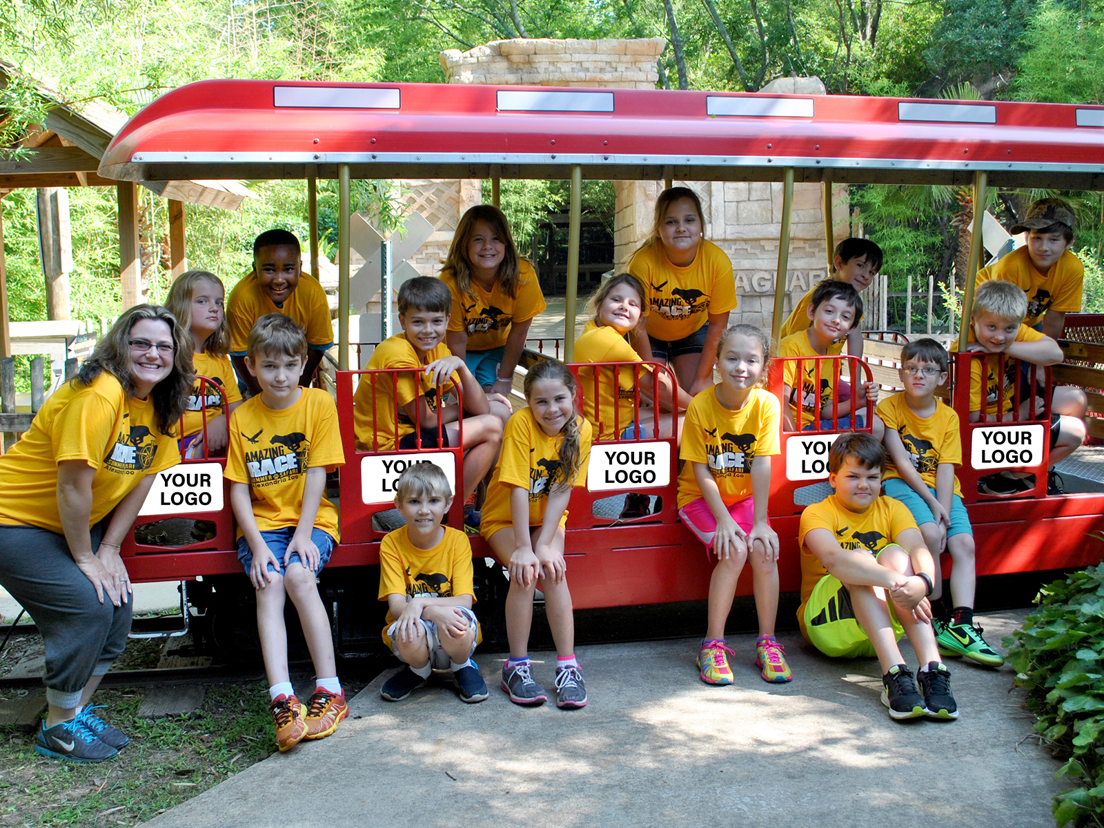 kids posing for photo on train car