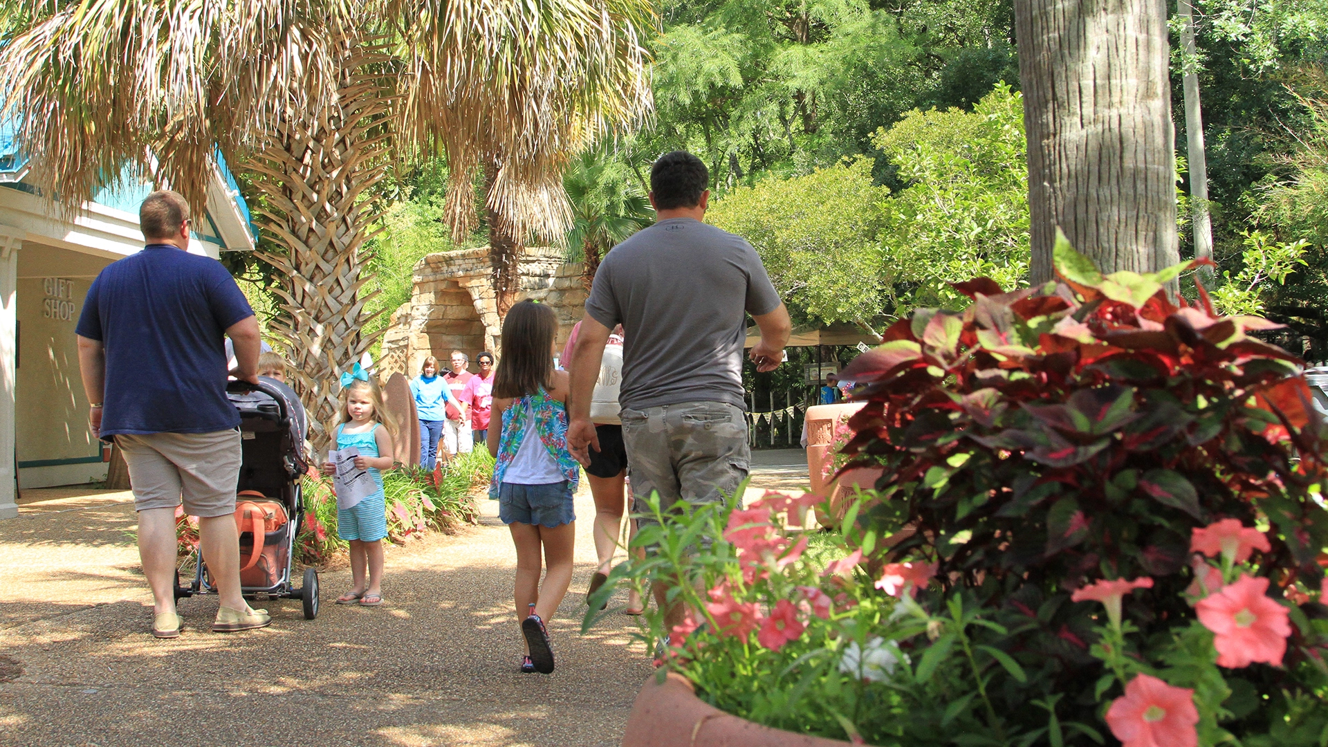 zoo visitors walking near main entrance