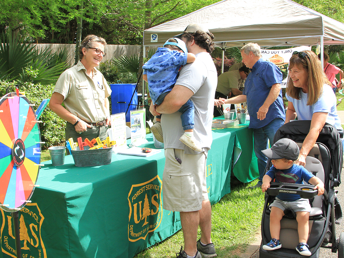 booth with vendor and visitors