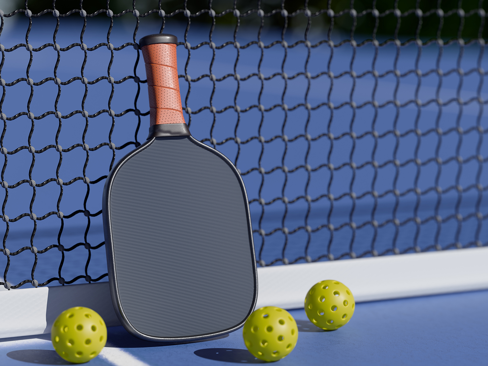 pickleball paddle and balls on blue court